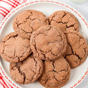 Mexican hot chocolate cookies piled on a white plate.