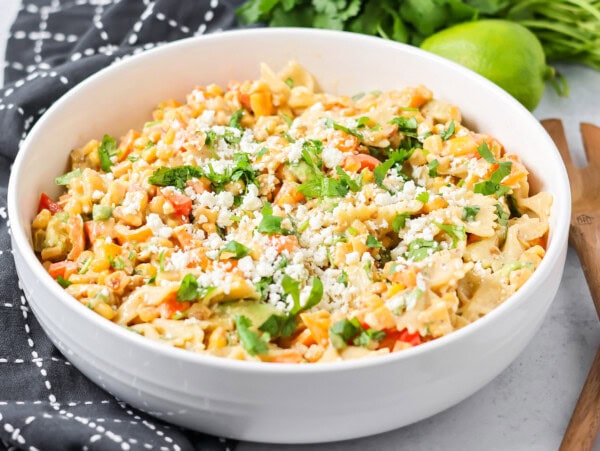 Fresh Mexican street corn pasta salad served in a white bowl.