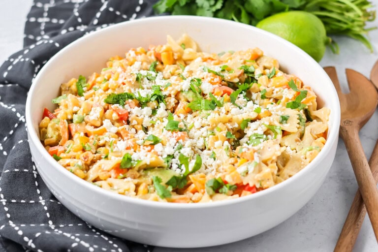 Fresh Mexican street corn pasta salad served in a white bowl.