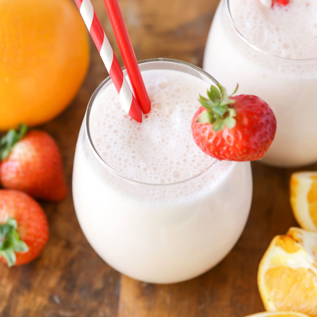 Blend a bright orange juice smoothie in 5 minutes, packed with strawberries, vanilla, and vitamin C for a quick breakfast the kids love. Glass of orange juice smoothies with a fresh strawberry garnish.