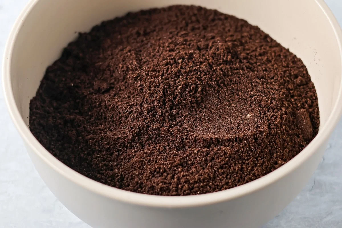 No-bake Oreo cream cheese balls are a three ingredient treat with a silky center and chocolate coating, ideal for every occasion. Fine Oreo cookie crumbs in a mixing bowl.