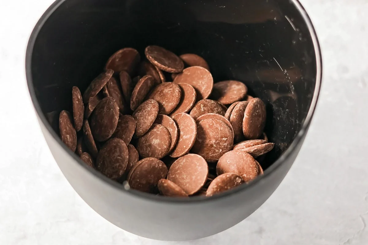 No-bake Oreo cream cheese balls are a three ingredient treat with a silky center and chocolate coating, ideal for every occasion. Chocolate wafers in a bowl.