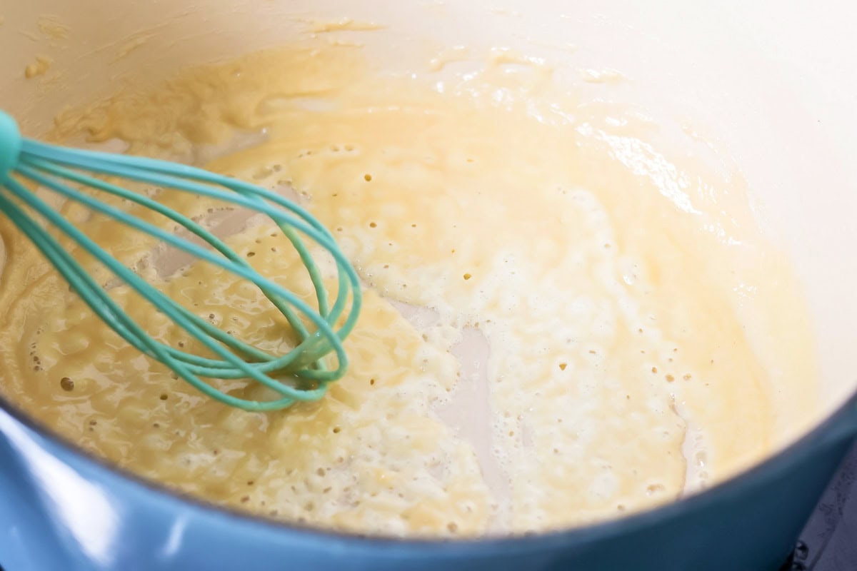 This flavorful Panera broccoli cheddar soup recipe tastes just like the original. Filled with hearty ingredients, it's sure to be a hit! Making a roux in a sauce pot.