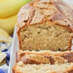 Peanut butter banana bread recipe cut into slices and placed on white plate.