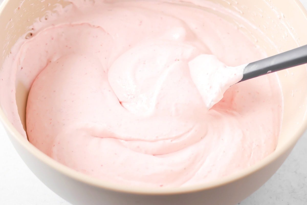 Strawberry mousse filling mixed together in bowl.