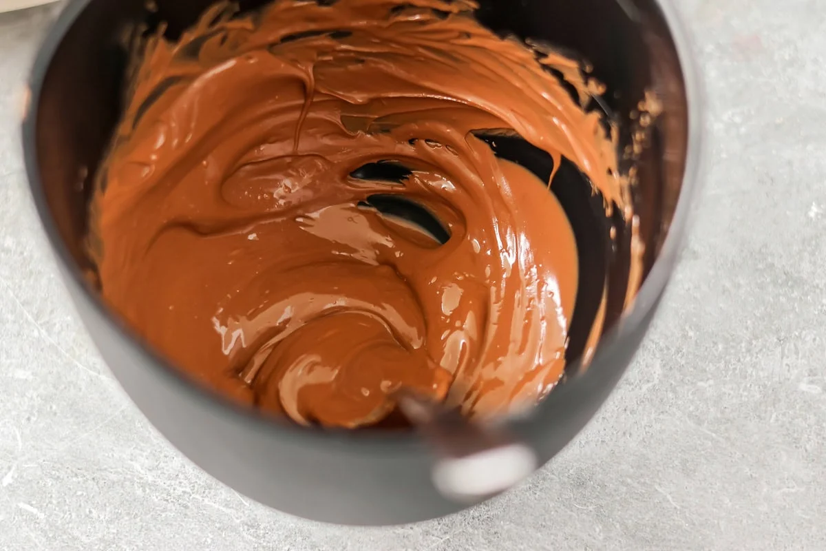 Melted chocolate chipa in a bowl.