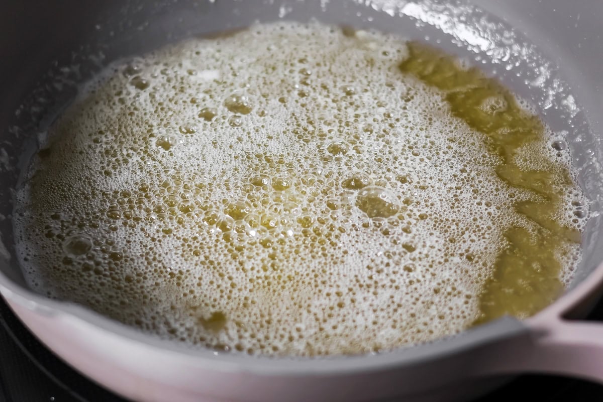 Browned butter toffee chocolate chip cookies with chewy centers and melty chips is an easy bakery-style cookie the whole family loves. Butter with foam in a pan.