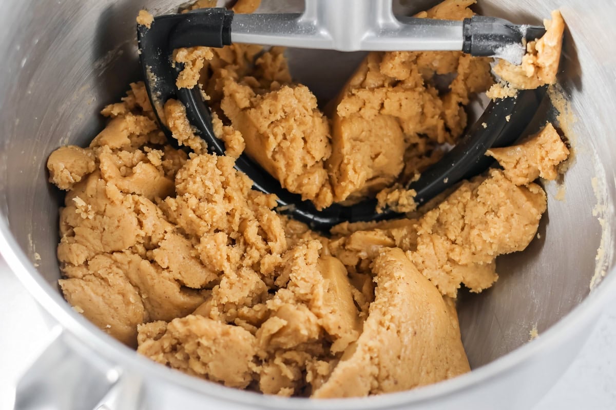 Browned butter toffee chocolate chip cookies with chewy centers and melty chips is an easy bakery-style cookie the whole family loves. Mixing cookie dough with a stand mixer.