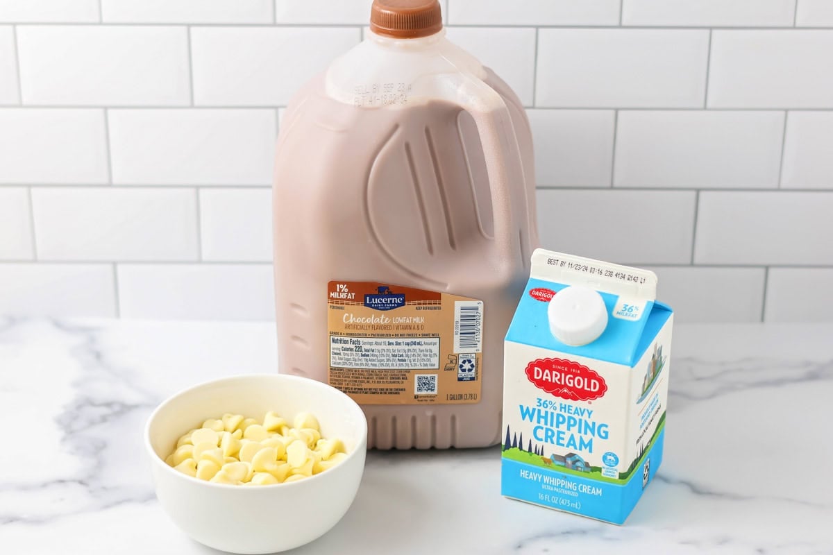Ingredients for crockpot hot chocolate on white counter.