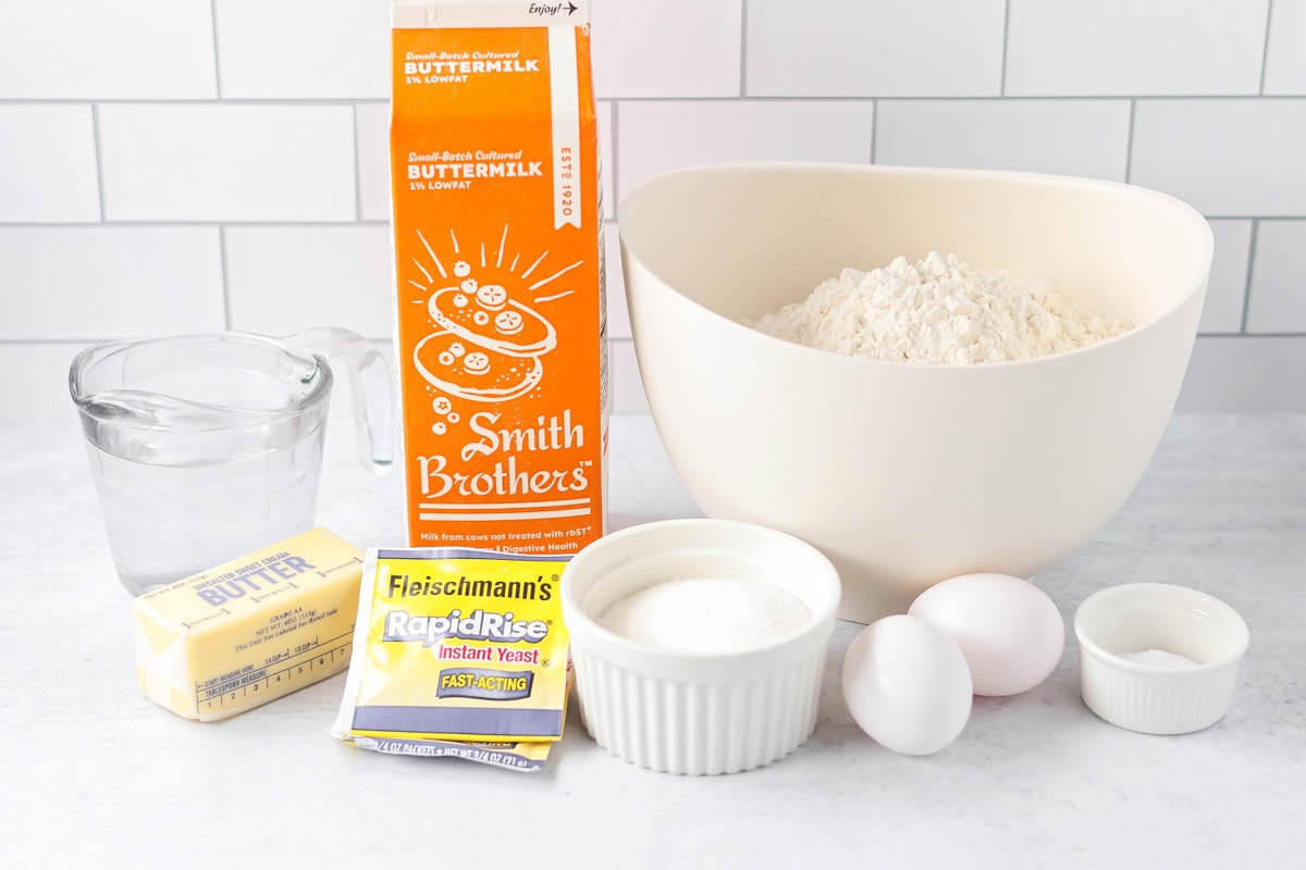 Easy cinnamon roll recipe ingredients on counter.