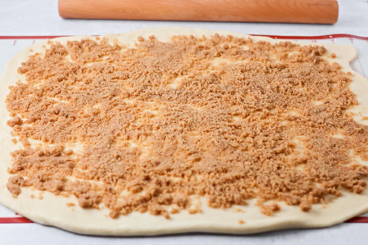 Brown sugar filling on cinnamon roll dough.