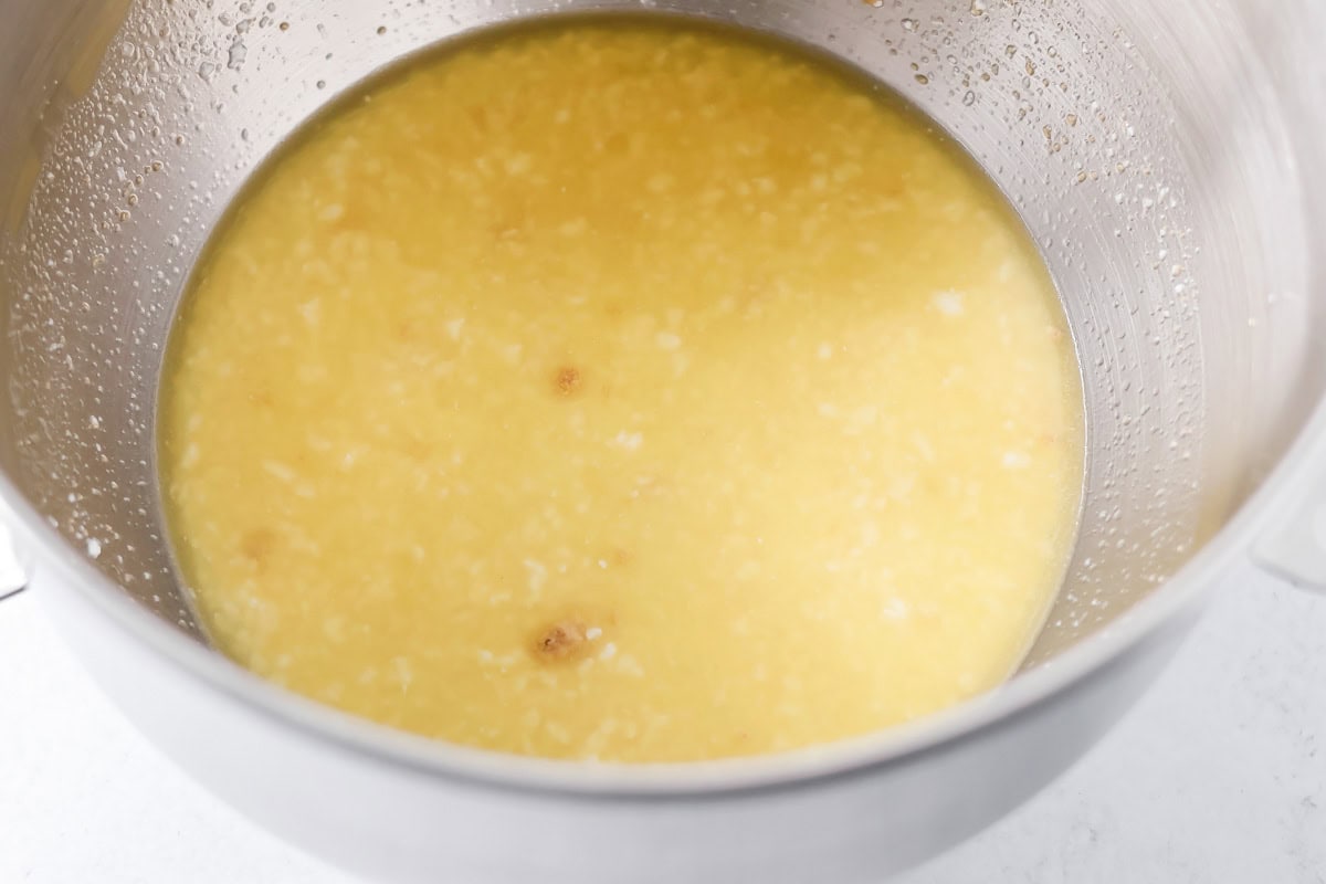 Water, buttermilk, sugar, melted butter and yeast in mixing bowl.