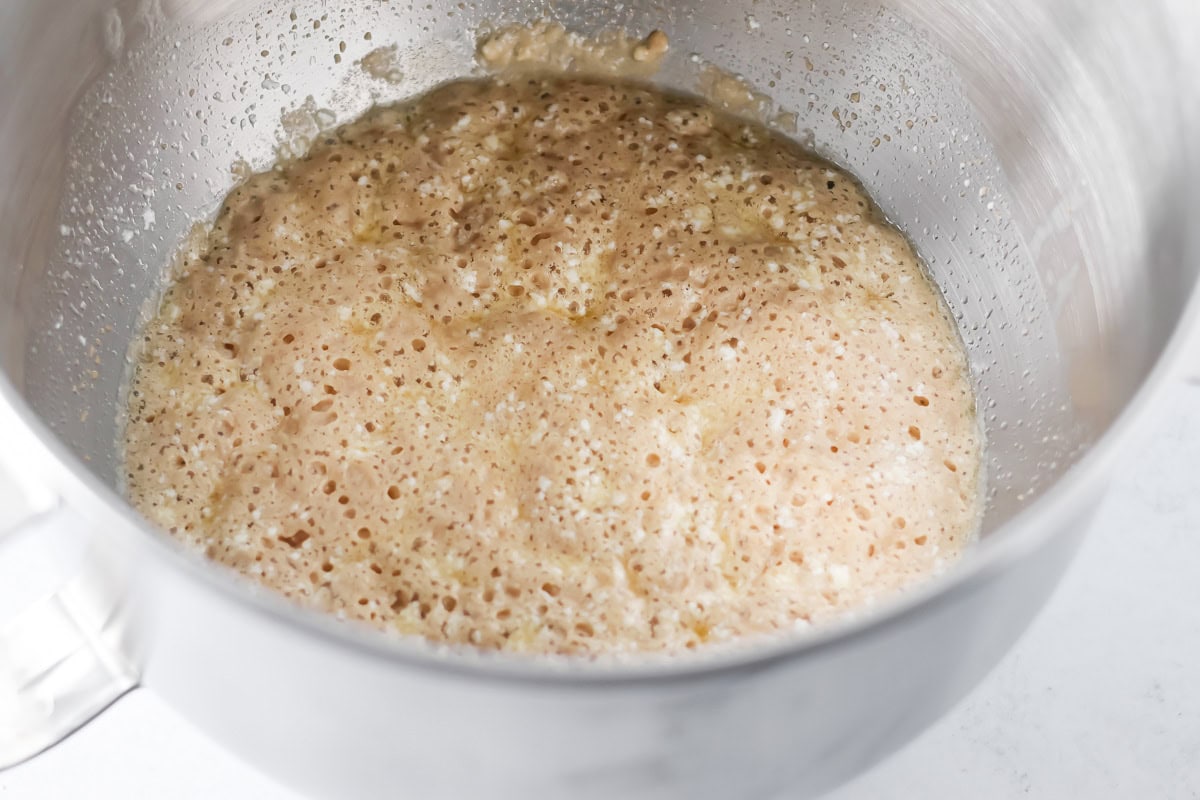 Cinnamon roll yeast ingredients in mixing bowl.