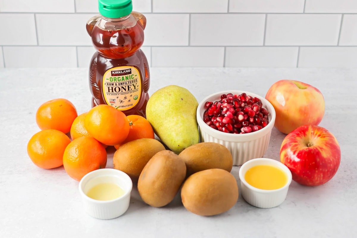 Bright and refreshing, this winter fruit salad blends clementines, kiwi, apples, pear, and pomegranate with a light citrus honey dressing. Ingredients for winter fruit salad.