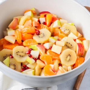Winter fruit salad served in a large white bowl.
