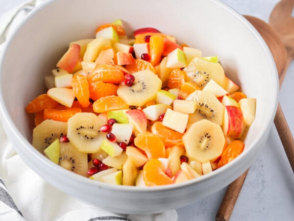 Winter fruit salad served in a large white bowl.