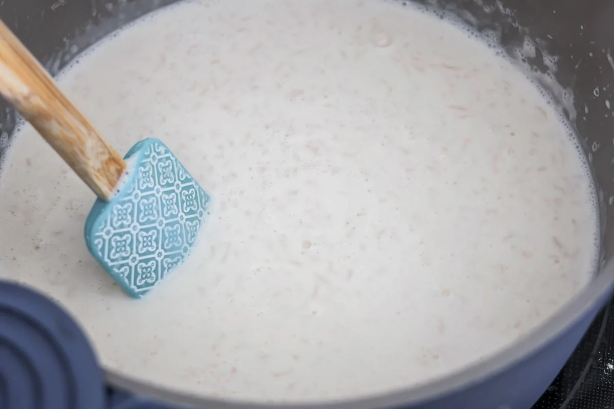 Creamy rice cooking in a pan.