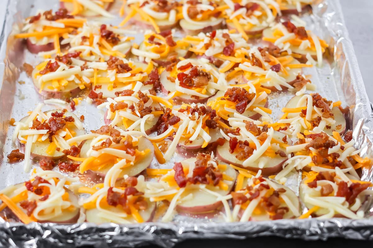 Potato rounds on foil lined sheet pan.