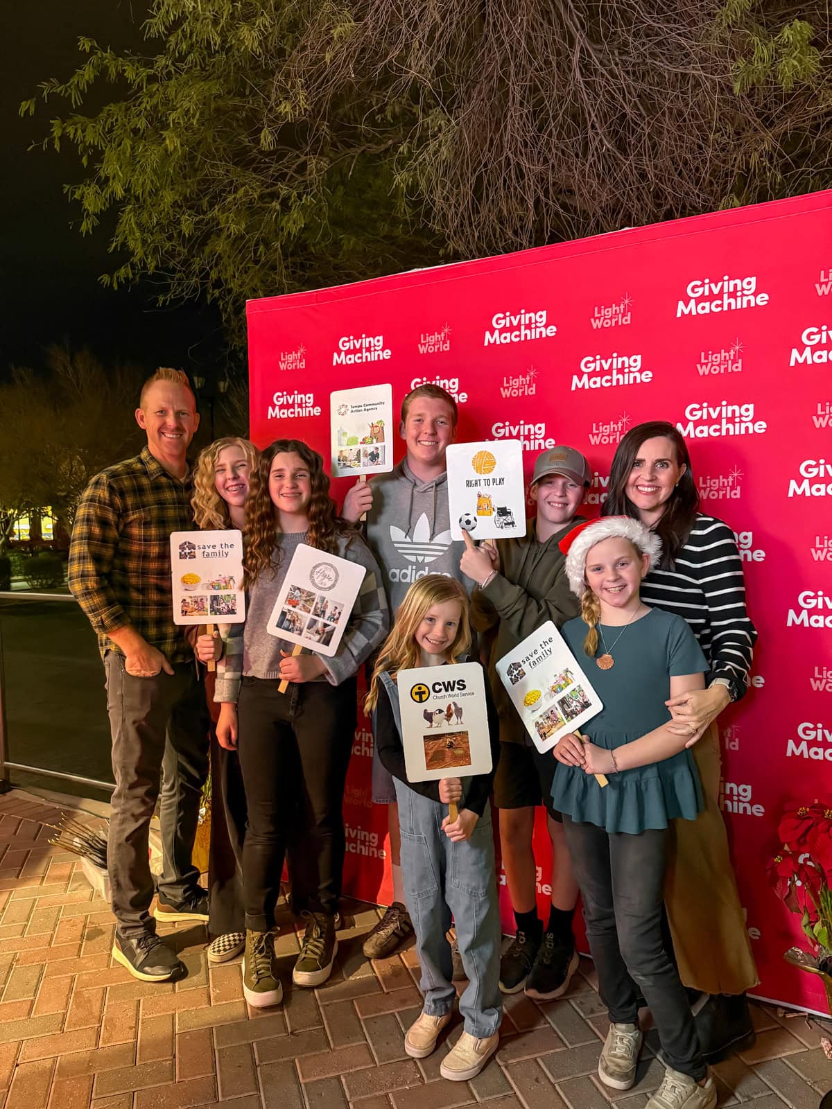 A family visiting the local Giving Machine.