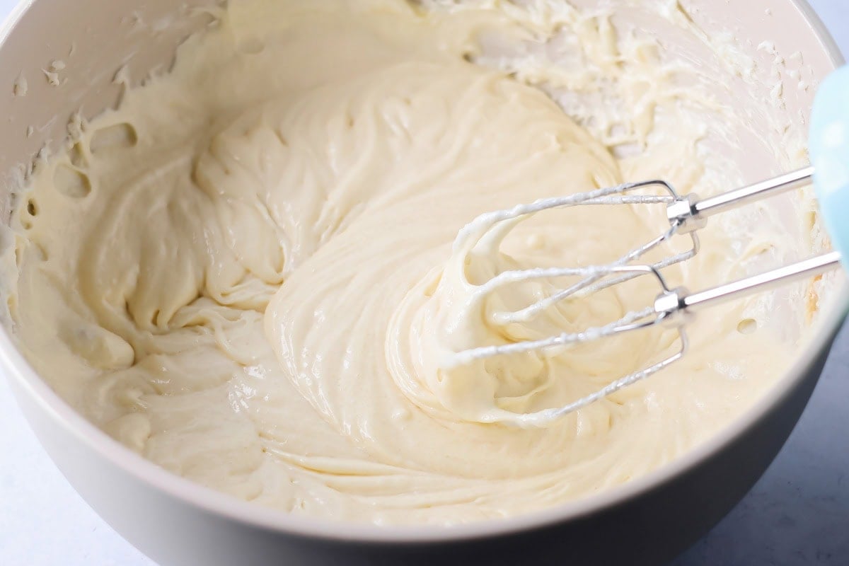 Cream cheese, butter and sugar mixed together in bowl.