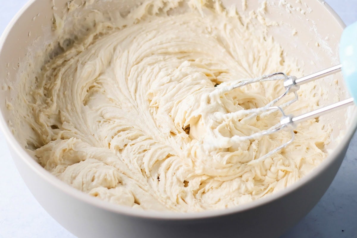 Cream cheese coffee cake batter mixed in bowl.