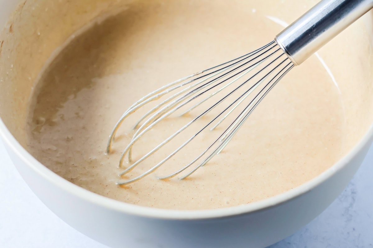 Soft cinnamon honey cupcakes with a crackly sugar top and creamy frosting, easy to make and perfect for parties or cozy weeknights. Cupcakes batter in a mixing bowl.