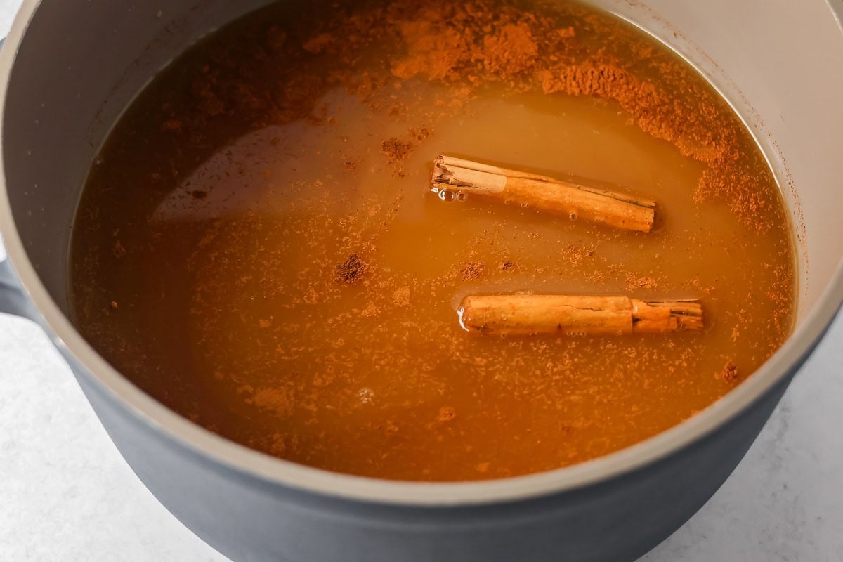 Ingredients for wassail recipe in pot.