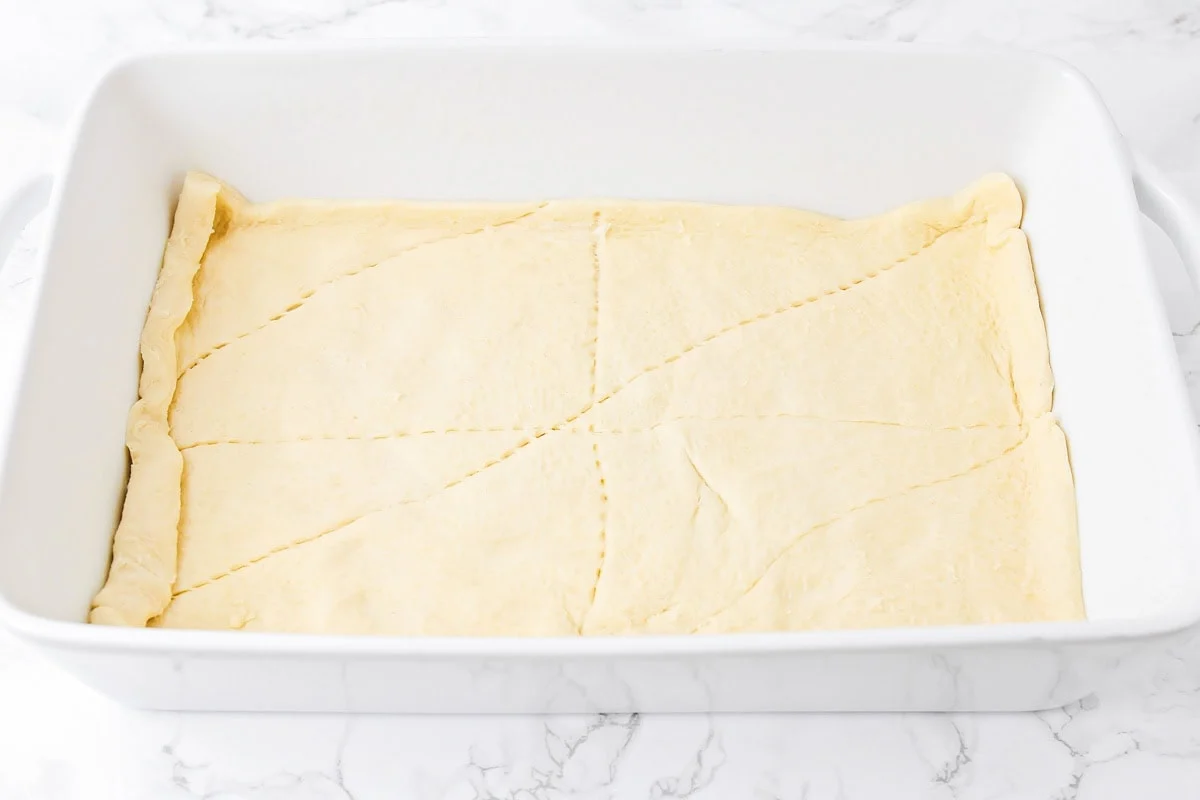 Crescent dough pressed into pan.