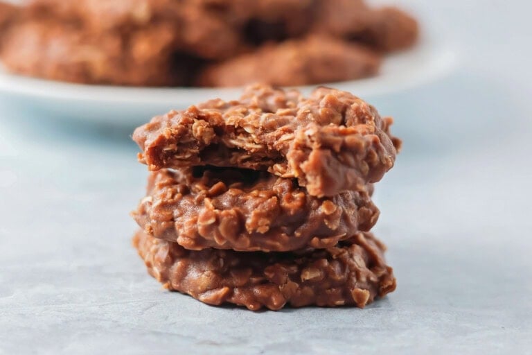 No bake cookies stacked on each other on white counter.