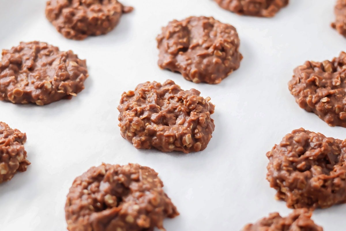 No bake cookie setting up on parchment paper.