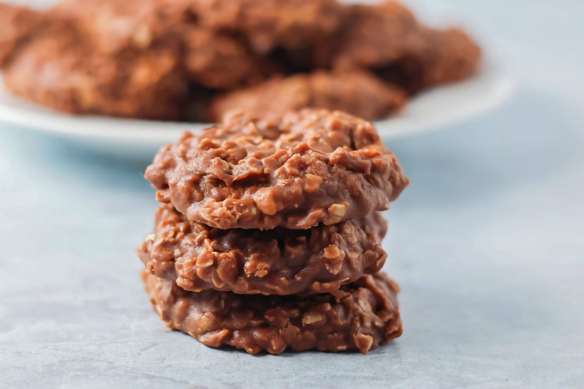 No bake cookies stacked on each other on countertop.