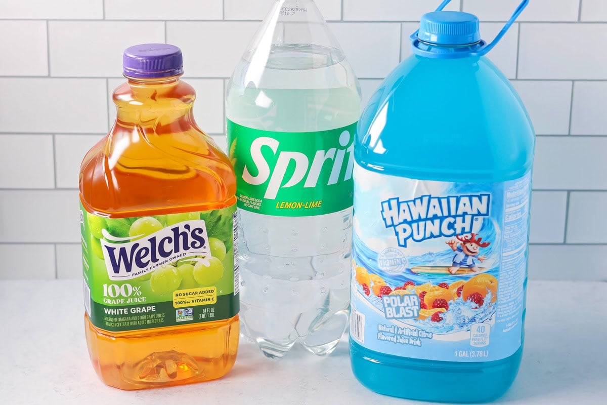 Ingredients for blue punch recipe on counter.