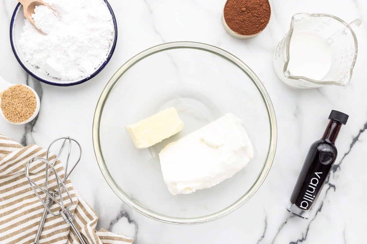 Cream cheese and butter in glass bowl.