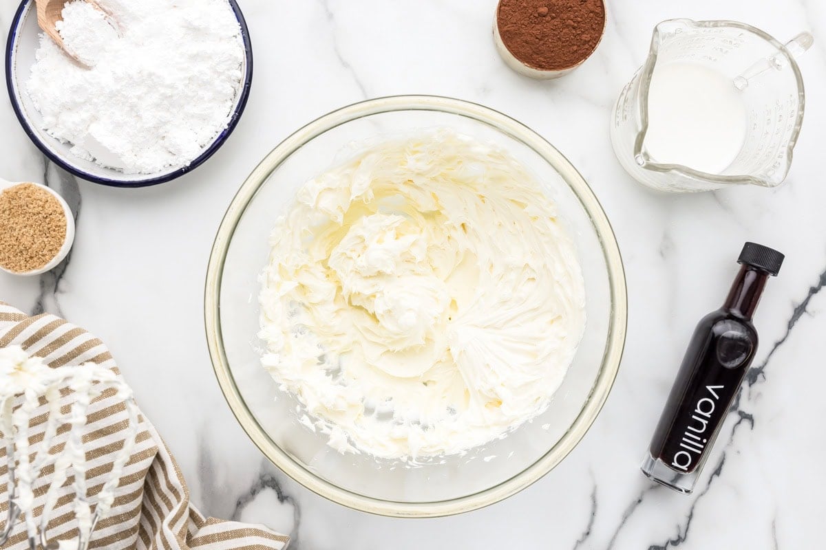 Cream cheese and butter mixed together in bowl.