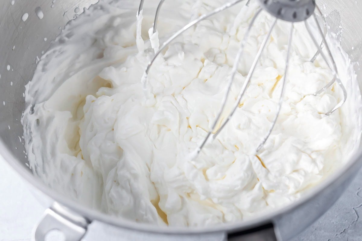 Whipped cream in a mixing bowl.