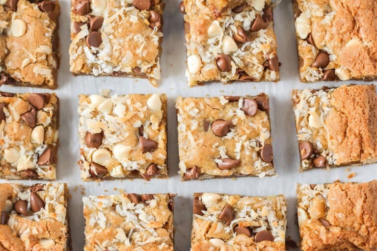 Sliced congo bars on a lined baking sheet.