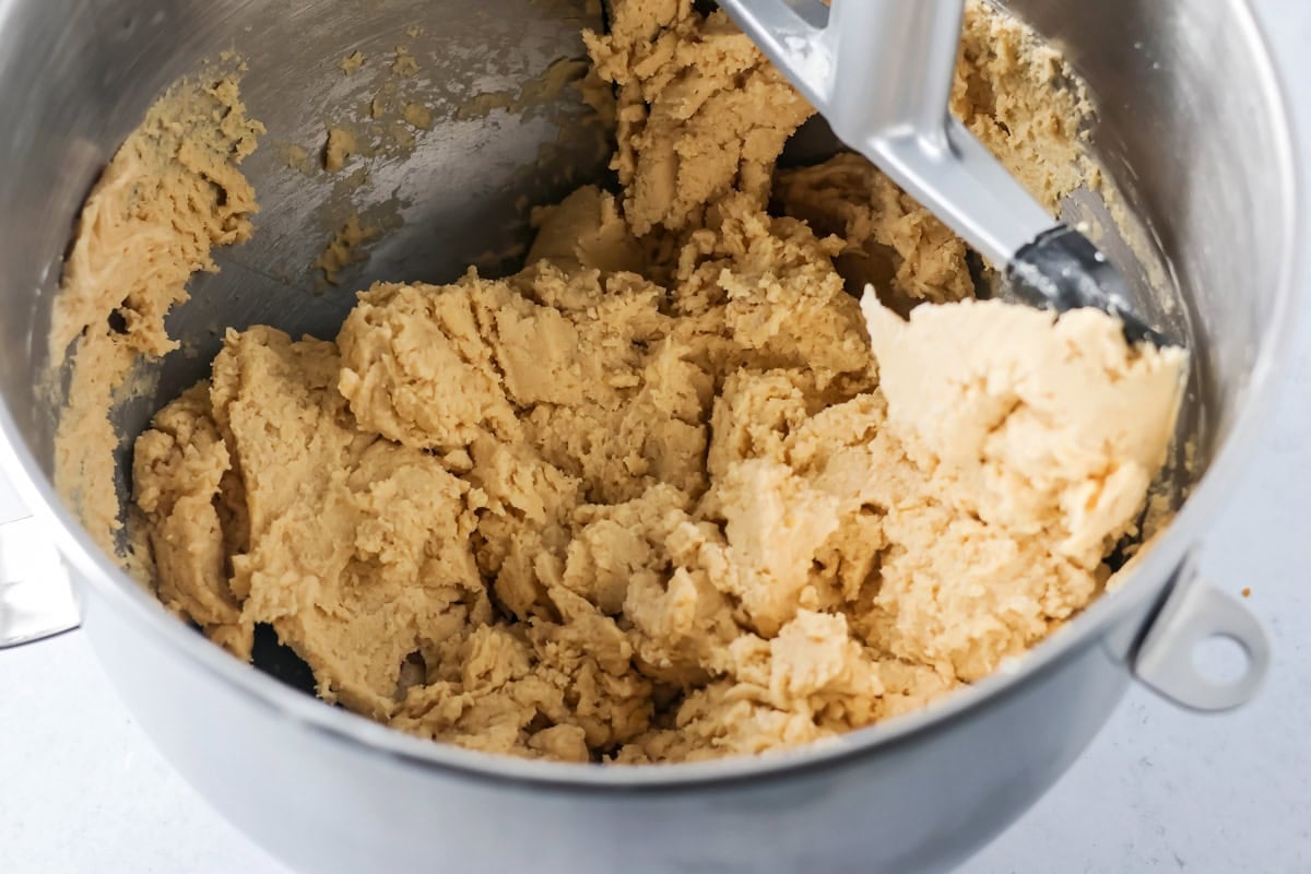 Cookie dough mixed together in metal bowl.