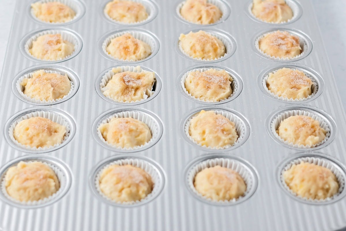 Cinnamon and sugar topped over mini banana muffins batter.