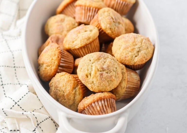 Mini Banana Muffins topped with cinnamon and sugar and in a large white dish.
