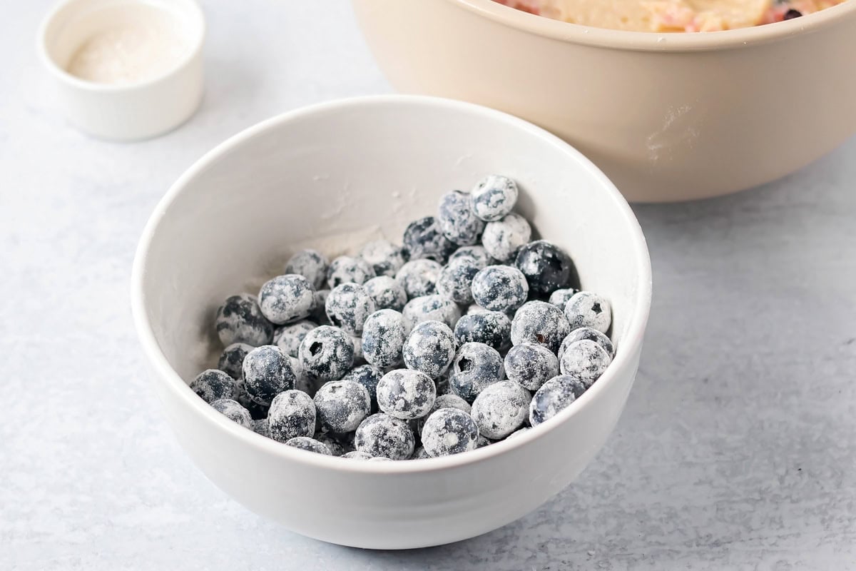 Blueberries tossed in flour for mini blueberry muffins recipe.
