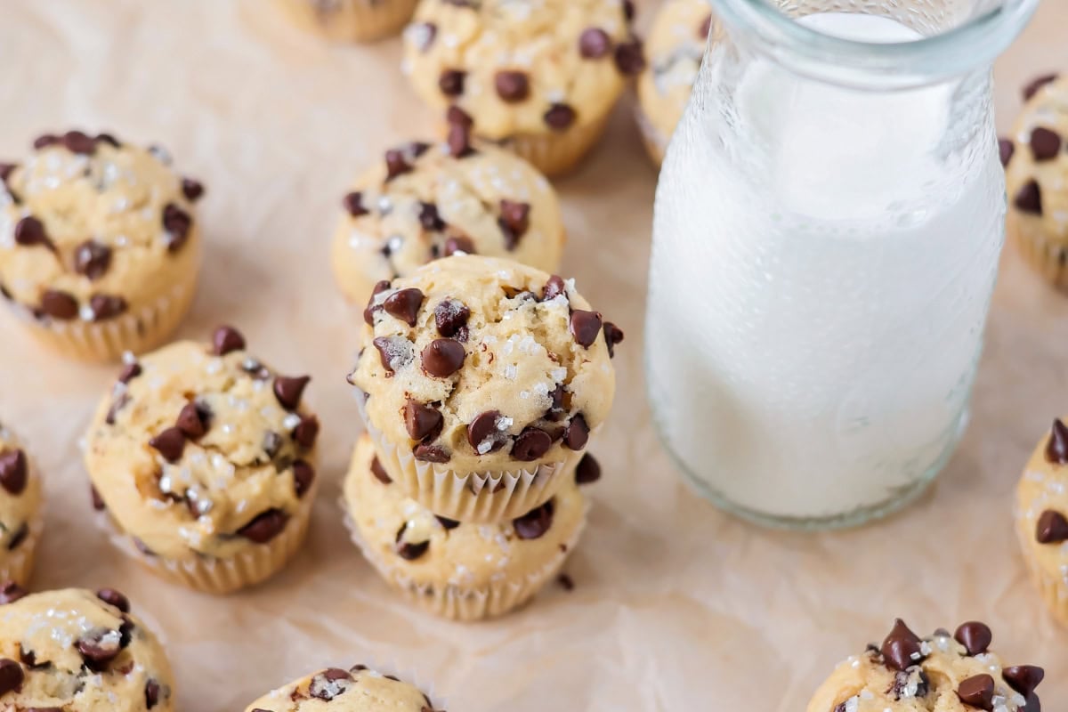 Mini Chocolate Chip Muffins stacked on each other by other muffins.