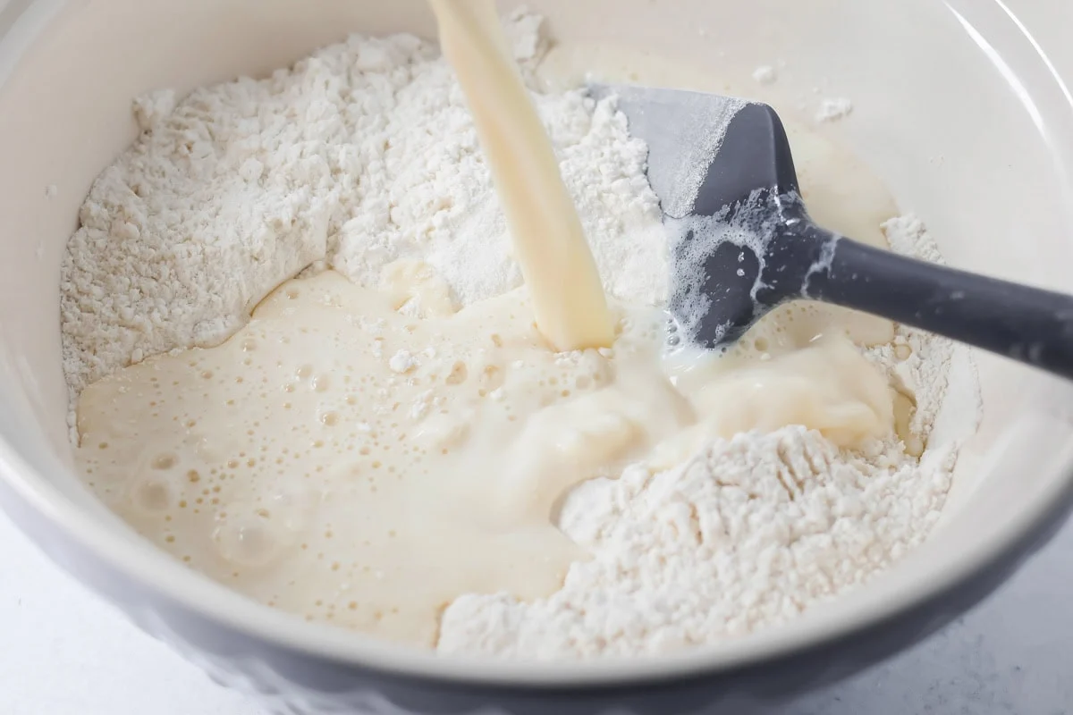 Homemade pancake batter being made in mixing bowl.