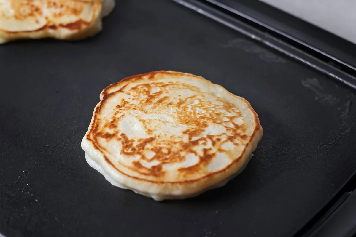 Easy pancakes being cooked on griddle.
