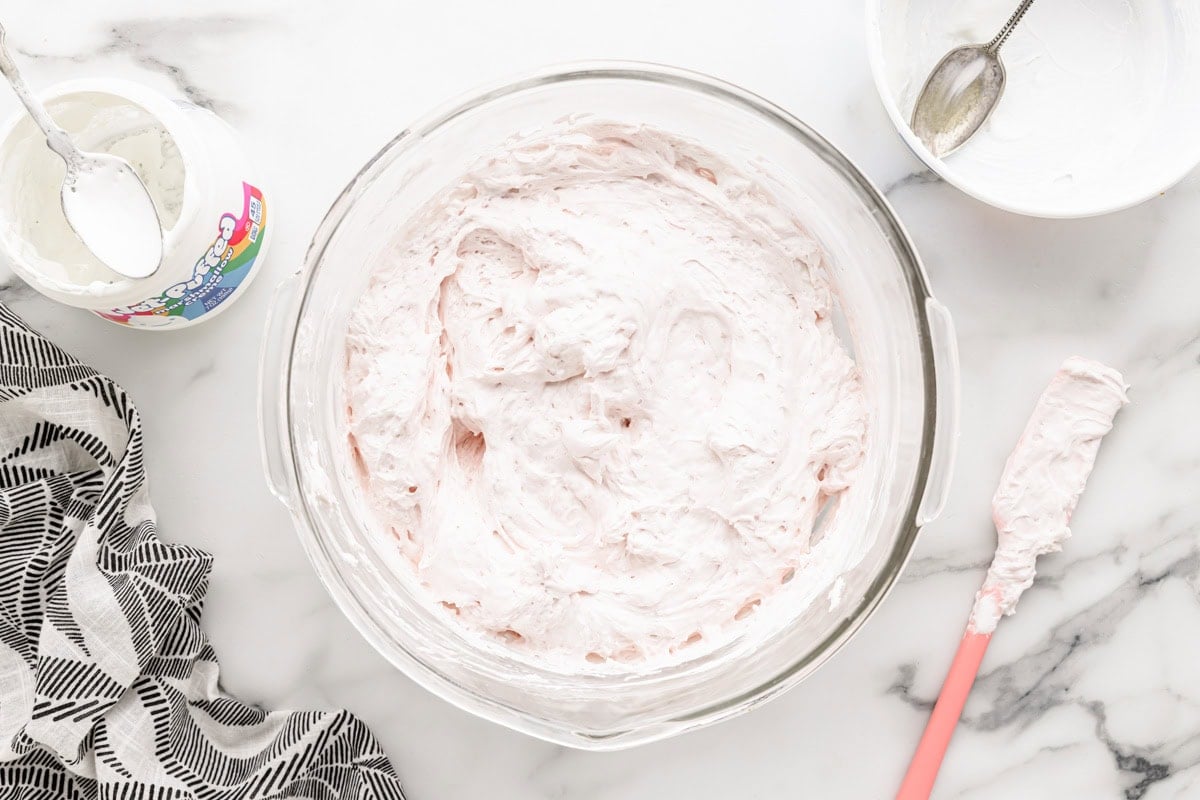 Adding whipped topping to dip recipe.