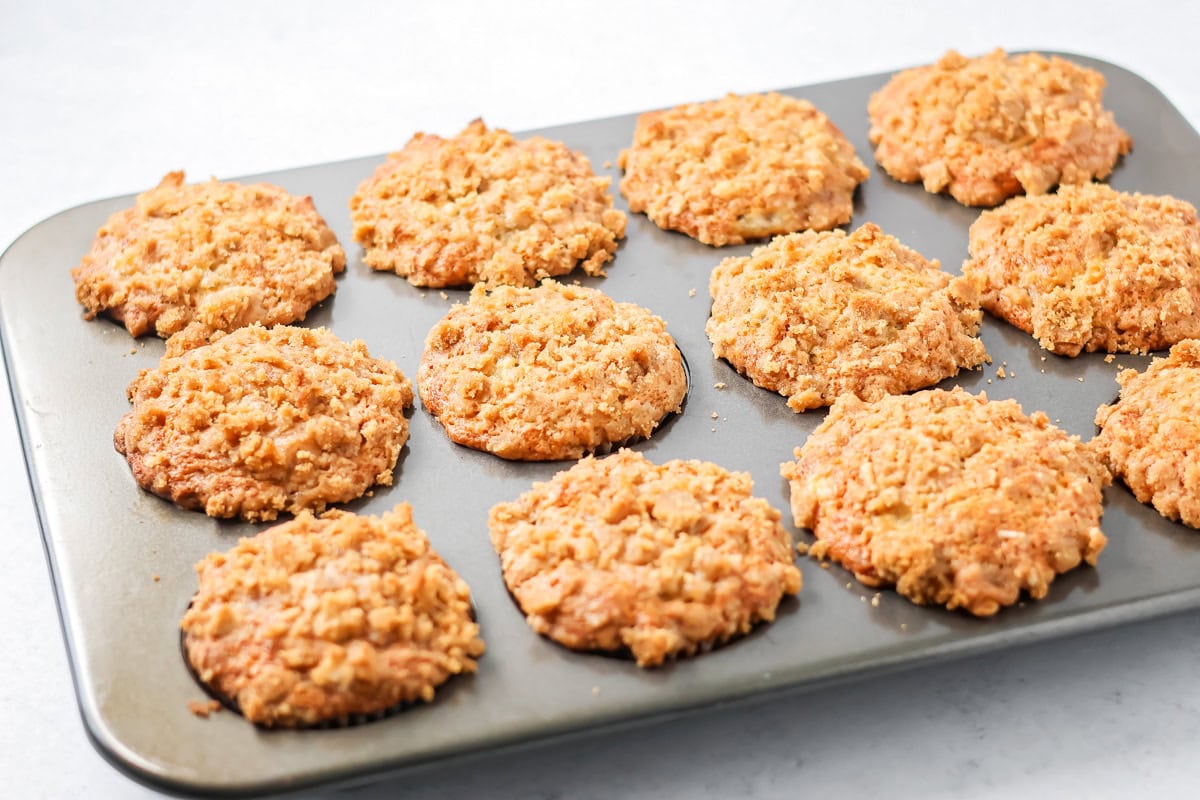 Baked banana crumb muffins in a tin.