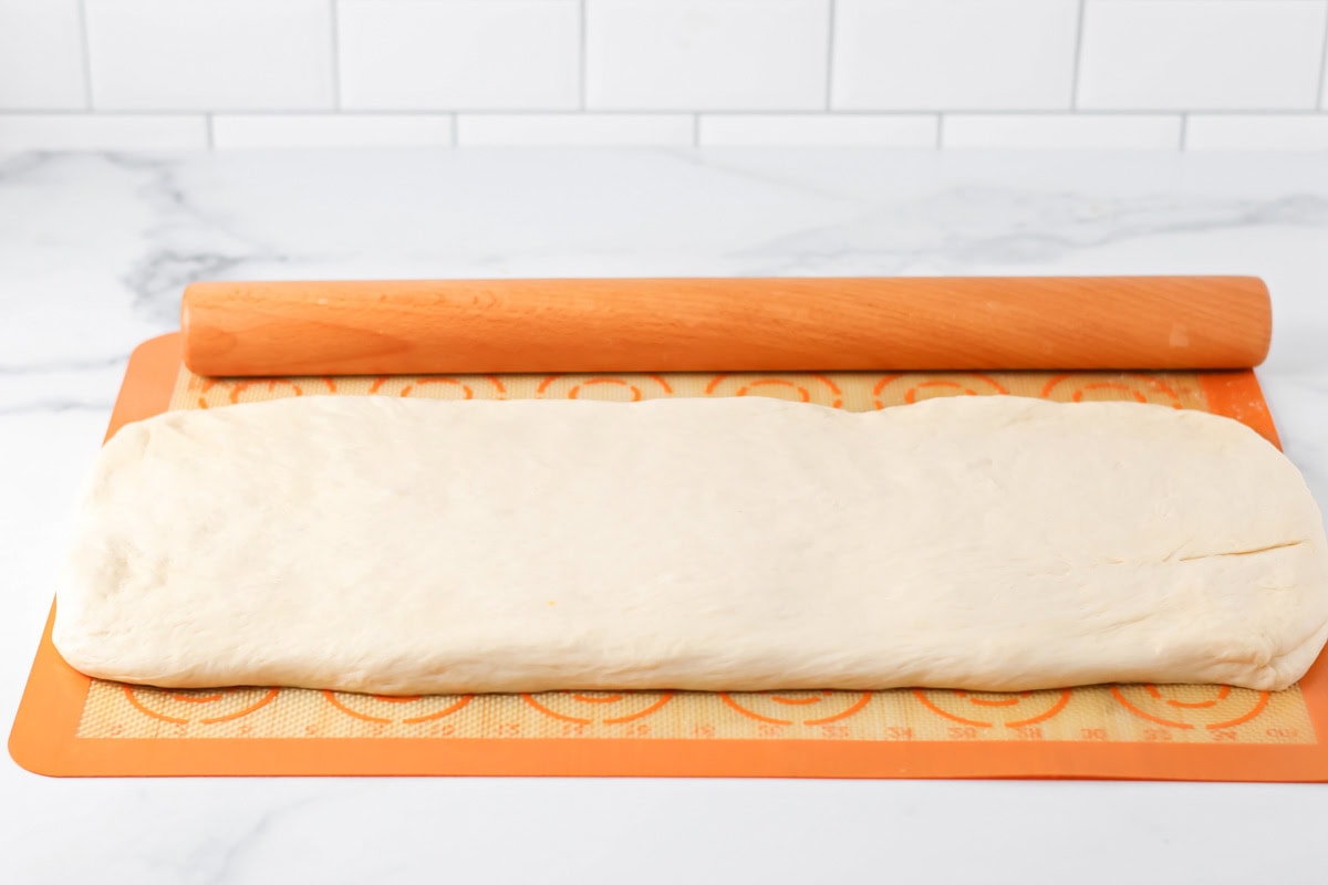 Breadstick dough spread and rolled on a silpat mat.