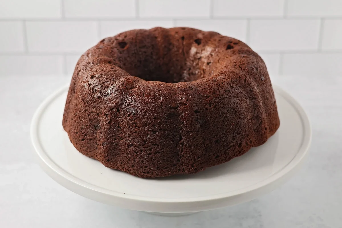 Brownie cake baked on cake stand.