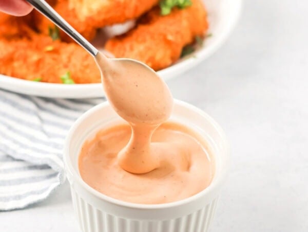 Cane's sauce served in a white ramekin.
