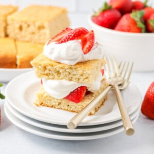 Classic strawberry shortcake served on a white plate.