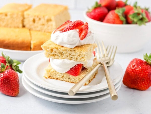 Classic strawberry shortcake served on a white plate.
